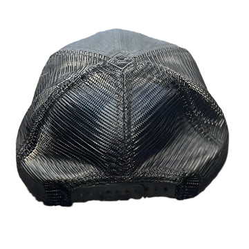 Black mesh cap on a textured surface