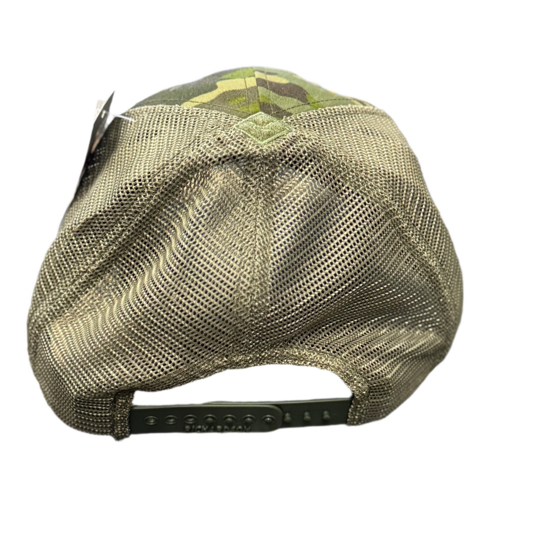 Green cap on a mesh surface