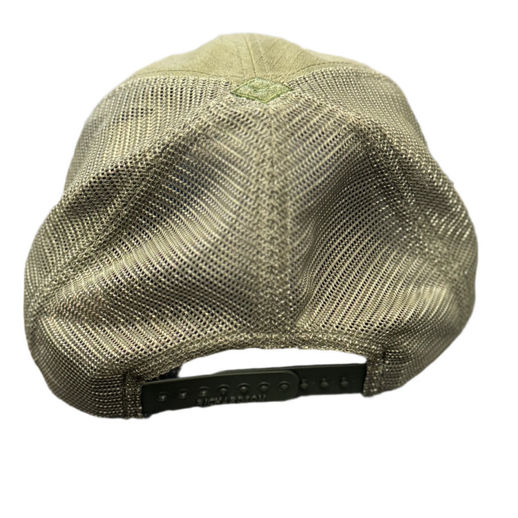 Green cap on a mesh surface