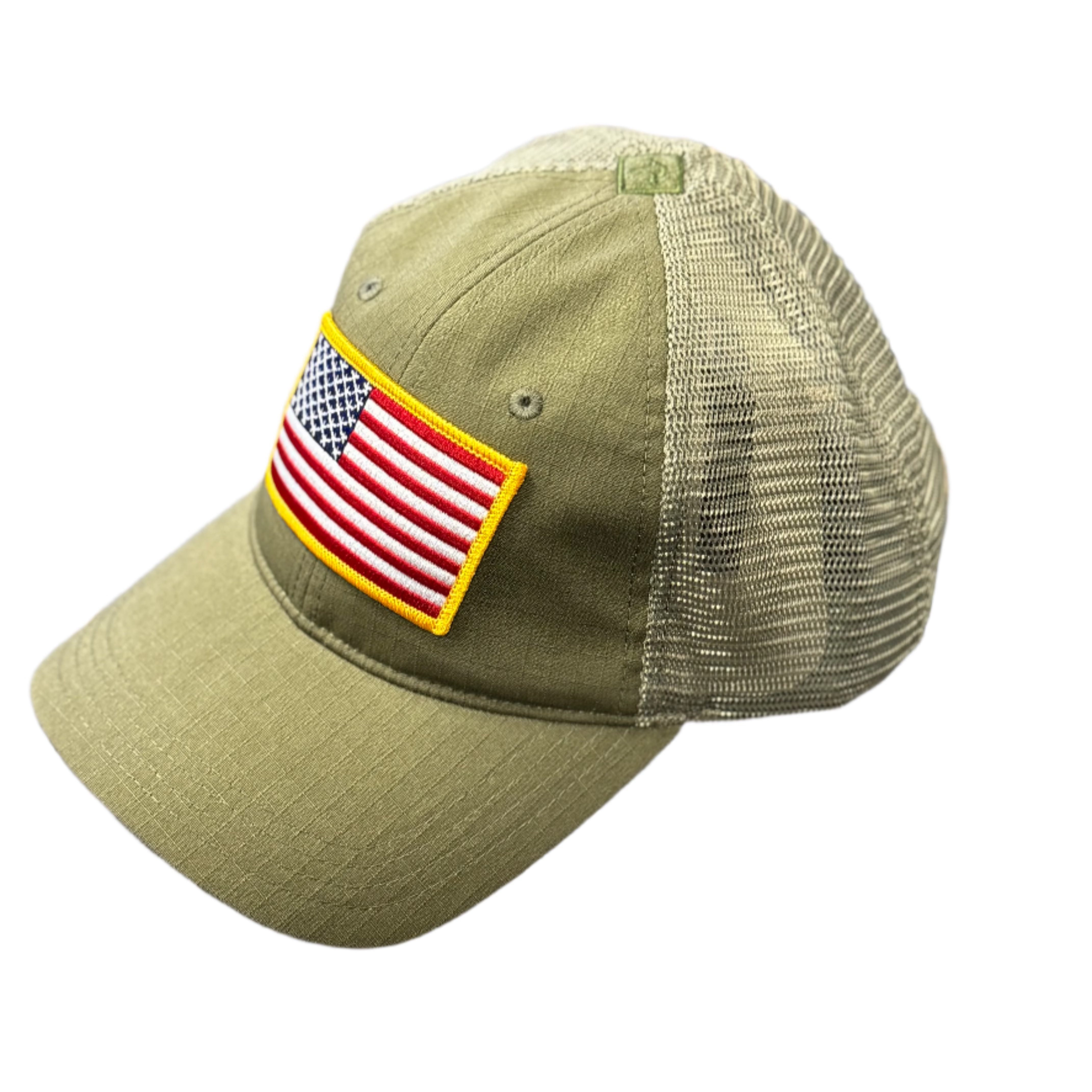 Green cap with American flag patch on a textured surface