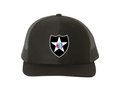 Black Richardson 112 trucker hat featuring the U.S. Army 2nd Infantry Division Indianhead star shield emblem on the front.